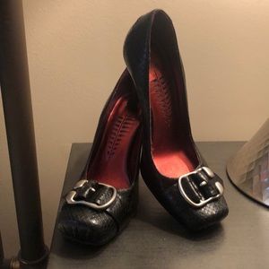 Black leather pumps